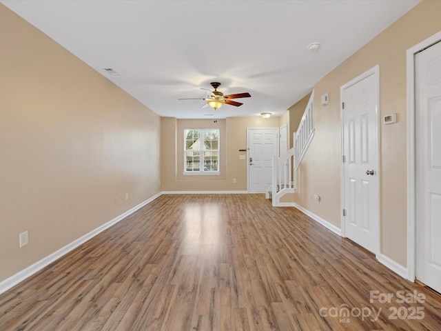 interior space with hardwood / wood-style flooring and ceiling fan