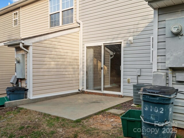 exterior space featuring cooling unit and a patio area