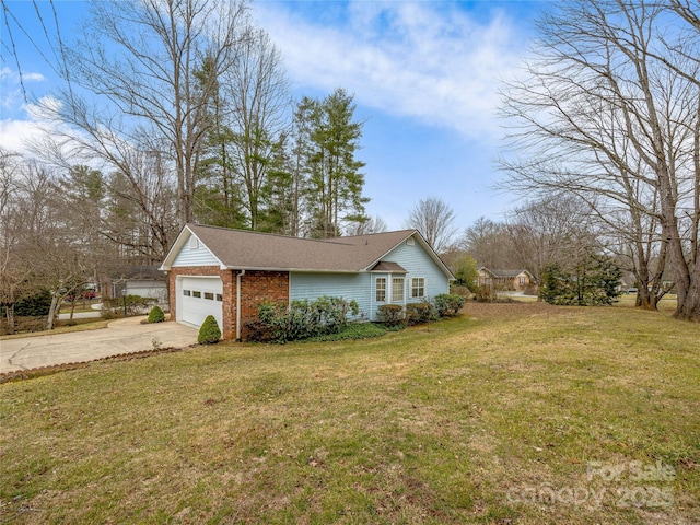 view of side of home featuring a garage and a lawn