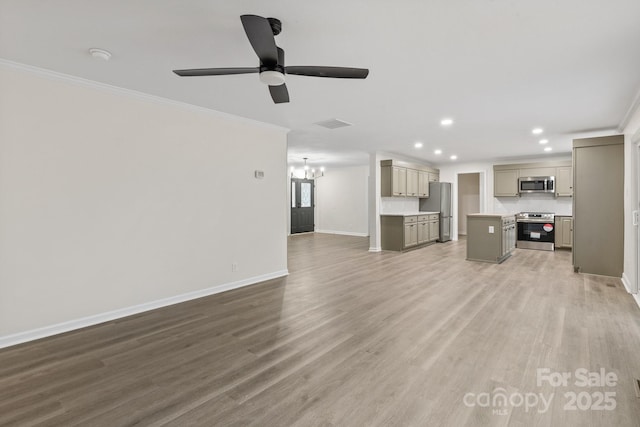 unfurnished living room featuring crown molding, ceiling fan with notable chandelier, and hardwood / wood-style flooring