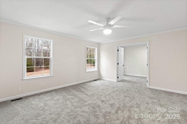 unfurnished room with light carpet, crown molding, and ceiling fan