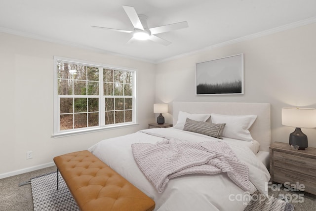 bedroom with ornamental molding, ceiling fan, and carpet flooring