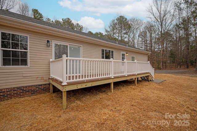 back of house featuring a wooden deck