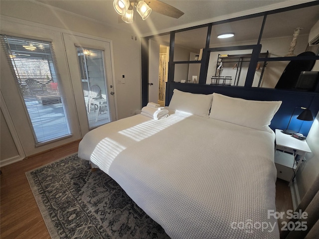 bedroom featuring crown molding, hardwood / wood-style flooring, and ceiling fan