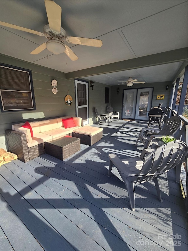 view of patio with ceiling fan, an outdoor hangout area, and a deck