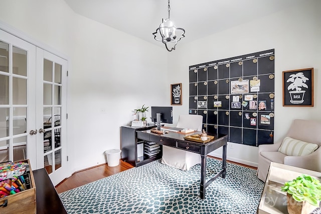 home office with french doors, wood-type flooring, and an inviting chandelier