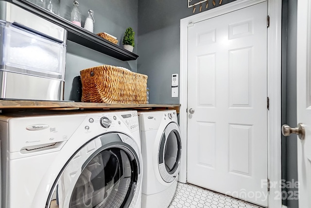 laundry area featuring washing machine and clothes dryer