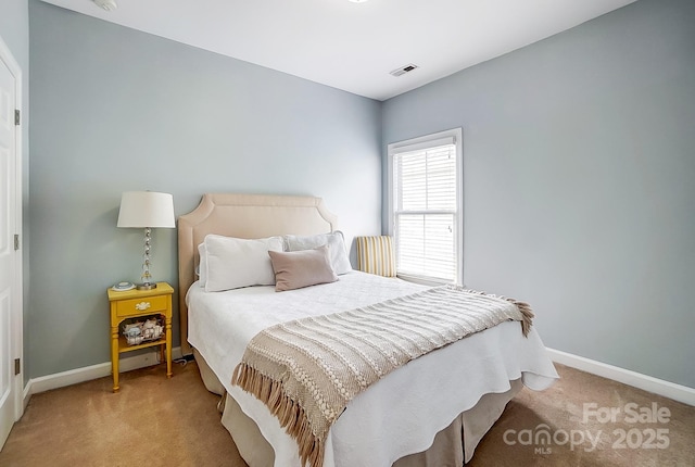 bedroom with light colored carpet