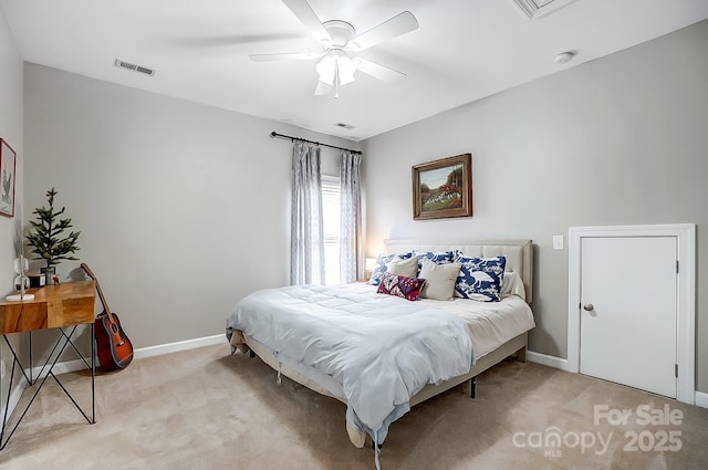 bedroom featuring light carpet and ceiling fan