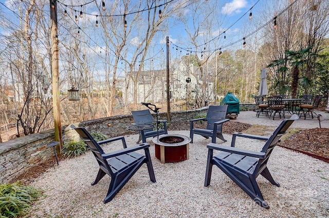 view of patio featuring a fire pit