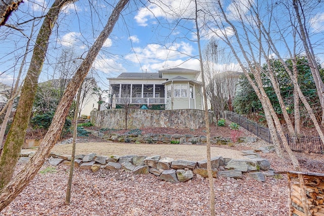 view of front of home featuring a sunroom