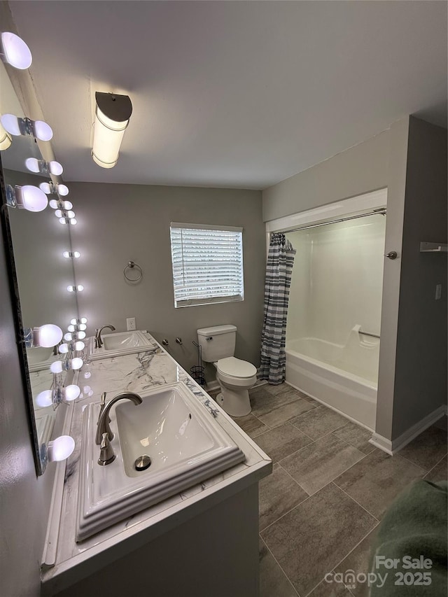 full bathroom featuring shower / bathtub combination with curtain, vanity, and toilet