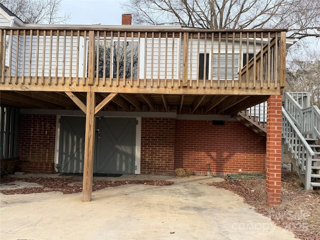 back of property featuring a wooden deck