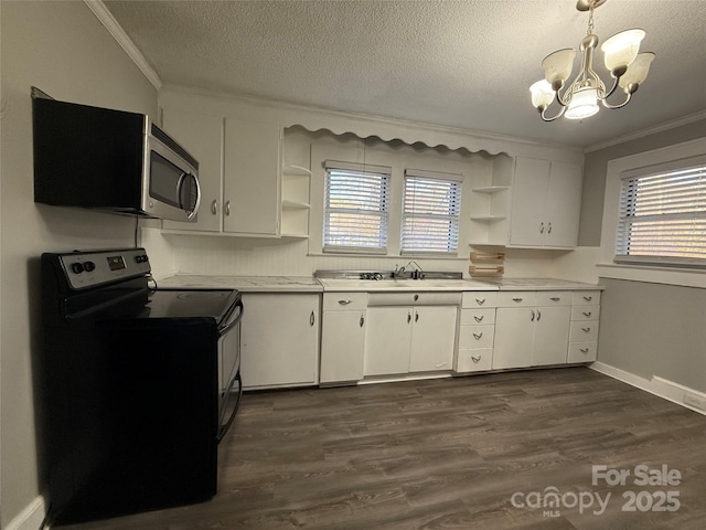 kitchen featuring hanging light fixtures, crown molding, black electric range, and white cabinets