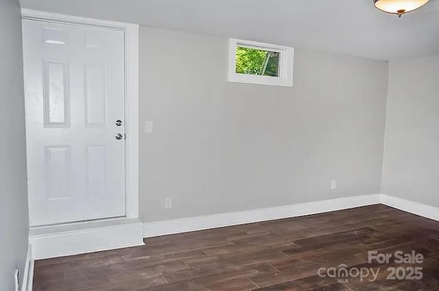 empty room with dark hardwood / wood-style floors