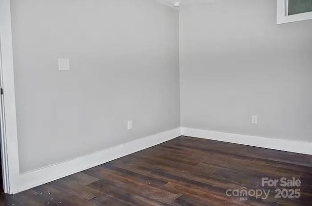 empty room featuring dark hardwood / wood-style floors