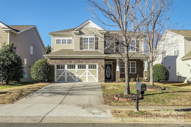 view of front of home with a garage and a front lawn