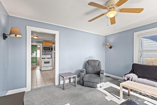 interior space featuring light carpet and ceiling fan