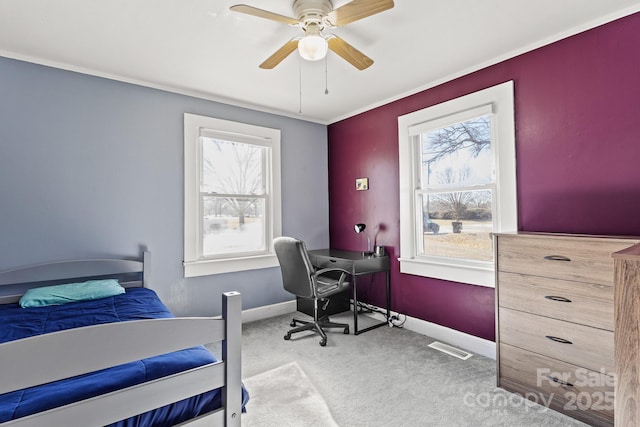 carpeted bedroom with multiple windows and ceiling fan