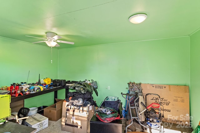 interior space with ceiling fan