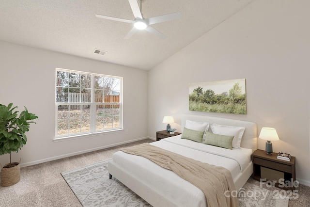 bedroom with lofted ceiling, carpet floors, and ceiling fan