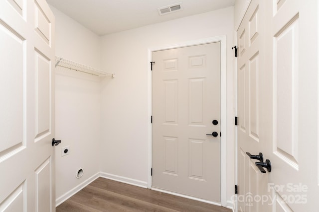 washroom featuring hardwood / wood-style flooring and hookup for an electric dryer