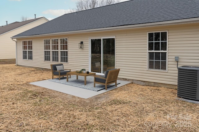 back of property featuring central AC unit and a patio area