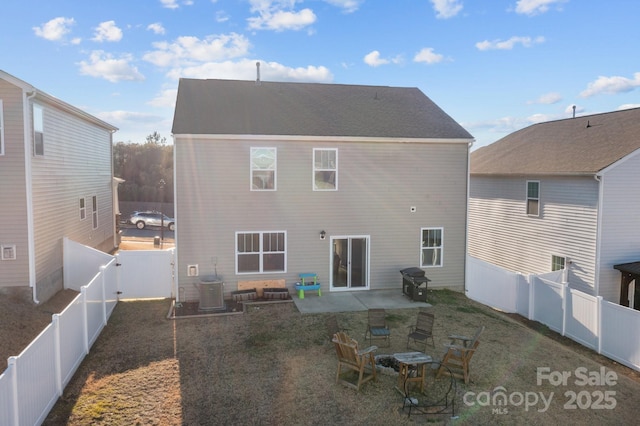 back of house featuring central AC and a patio area