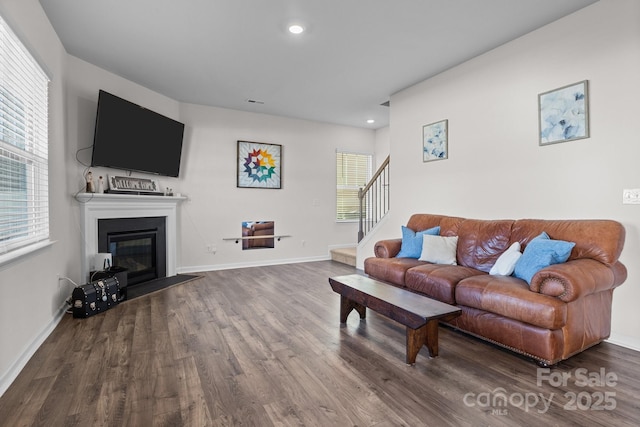 living room with hardwood / wood-style flooring and plenty of natural light