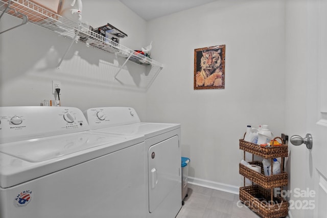 laundry area featuring washing machine and clothes dryer