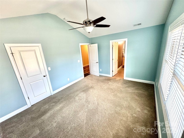 unfurnished bedroom with vaulted ceiling, carpet, and ceiling fan