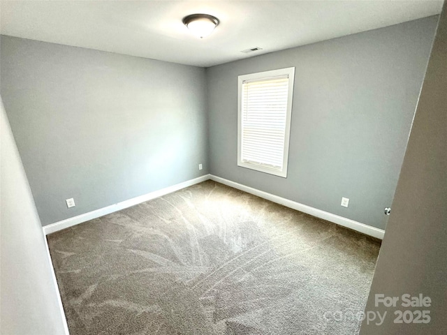 unfurnished room with carpet flooring