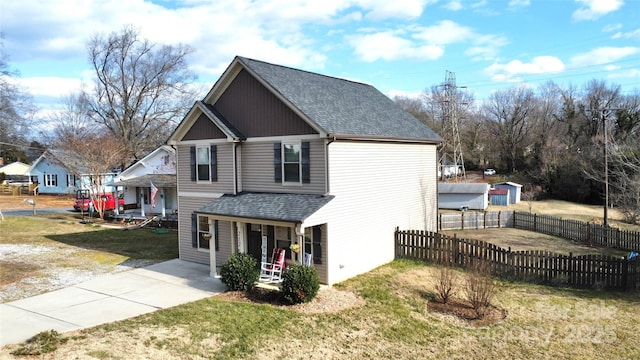 exterior space with covered porch and a front yard