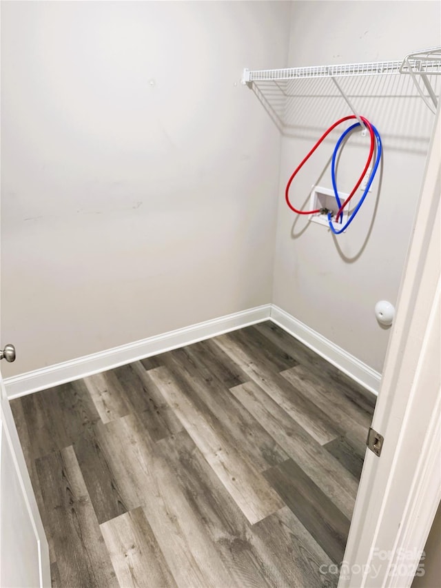 laundry area featuring hardwood / wood-style floors