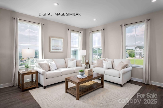 living room featuring a healthy amount of sunlight and dark hardwood / wood-style flooring