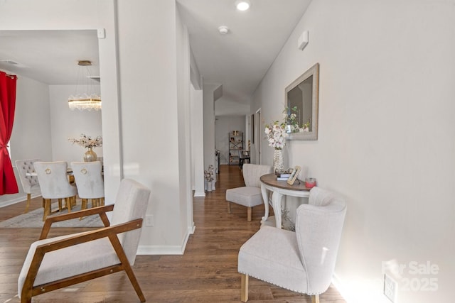 corridor with hardwood / wood-style floors