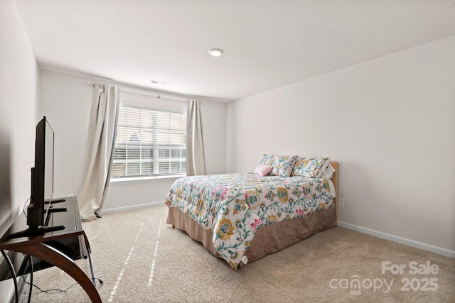 bedroom featuring light colored carpet