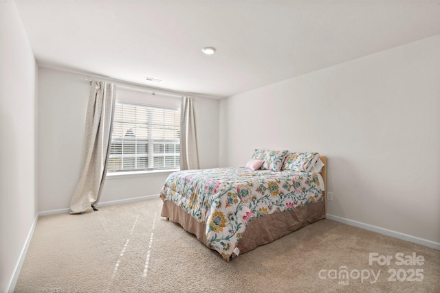 bedroom with light carpet