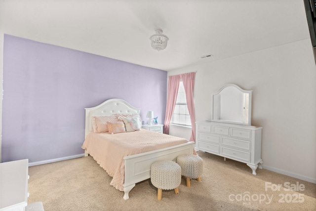 bedroom featuring light colored carpet