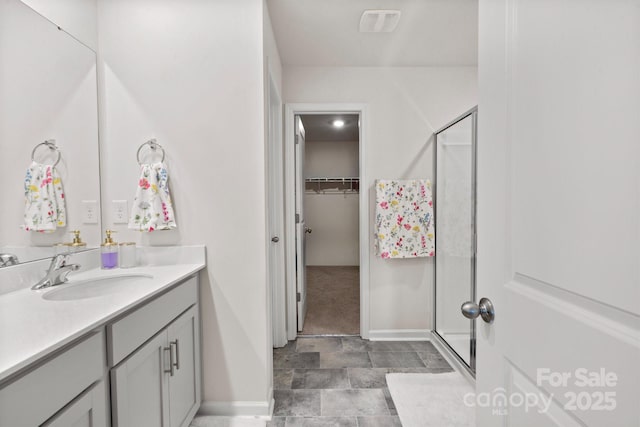 bathroom with vanity and walk in shower