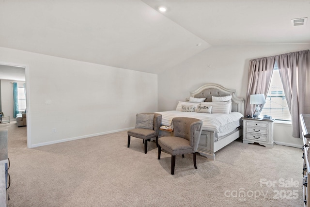 bedroom featuring vaulted ceiling and light colored carpet