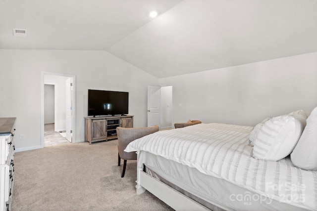 bedroom featuring lofted ceiling and light colored carpet