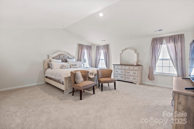 bedroom featuring vaulted ceiling and light carpet