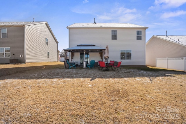 rear view of house featuring a gazebo