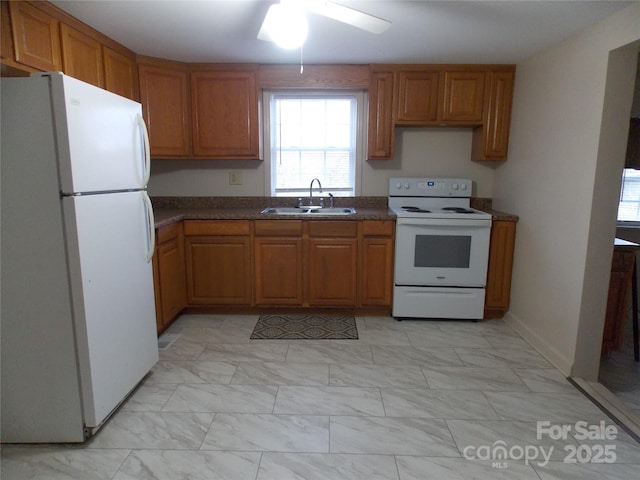 kitchen with ceiling fan, white appliances, and sink