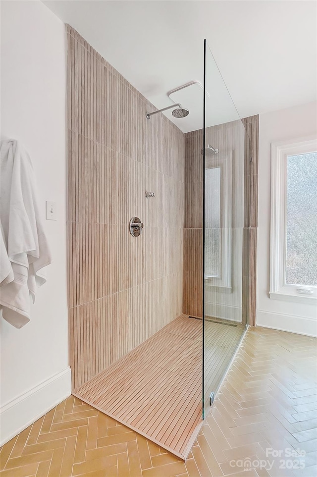 bathroom with parquet floors and tiled shower