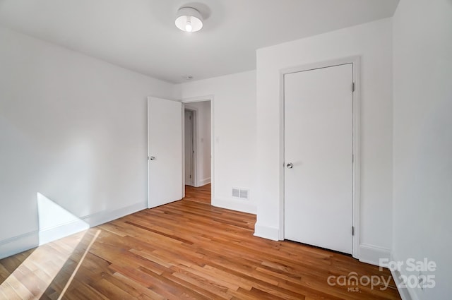 unfurnished bedroom featuring light hardwood / wood-style flooring