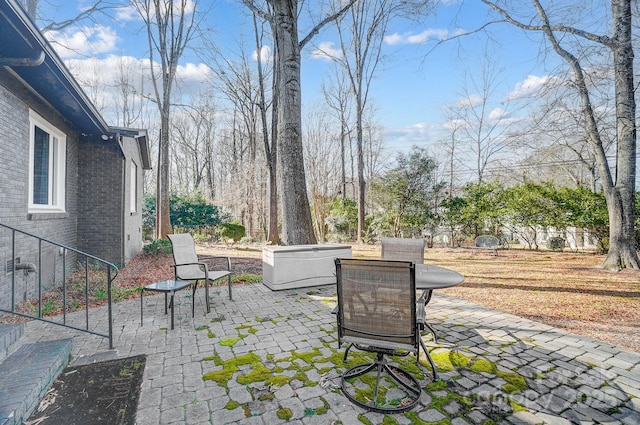 view of patio / terrace featuring a hot tub