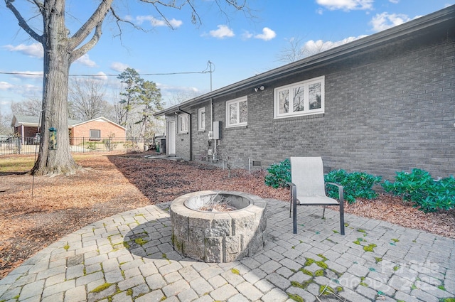 view of patio with a fire pit