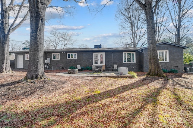 rear view of house featuring central AC and a patio